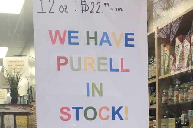 A sign for Purell in a shop window, showing a high price